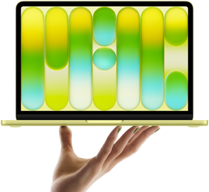 MacBook Neo in citrus color, balanced on fingertips of open hand, screen displaying colorful abstract pattern